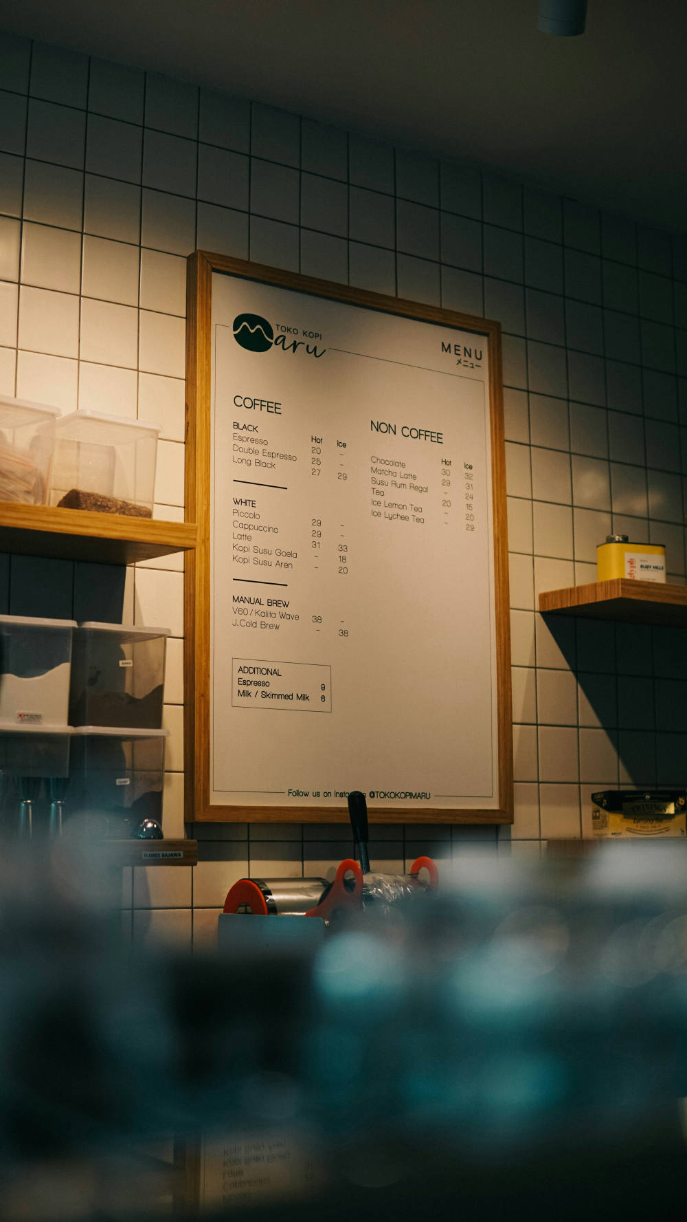 A printed paper menu next to the digital AI menu that replaces it
